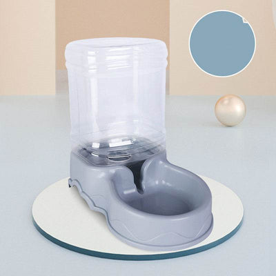 Dog automatic drinking fountain for pets on a round platform.